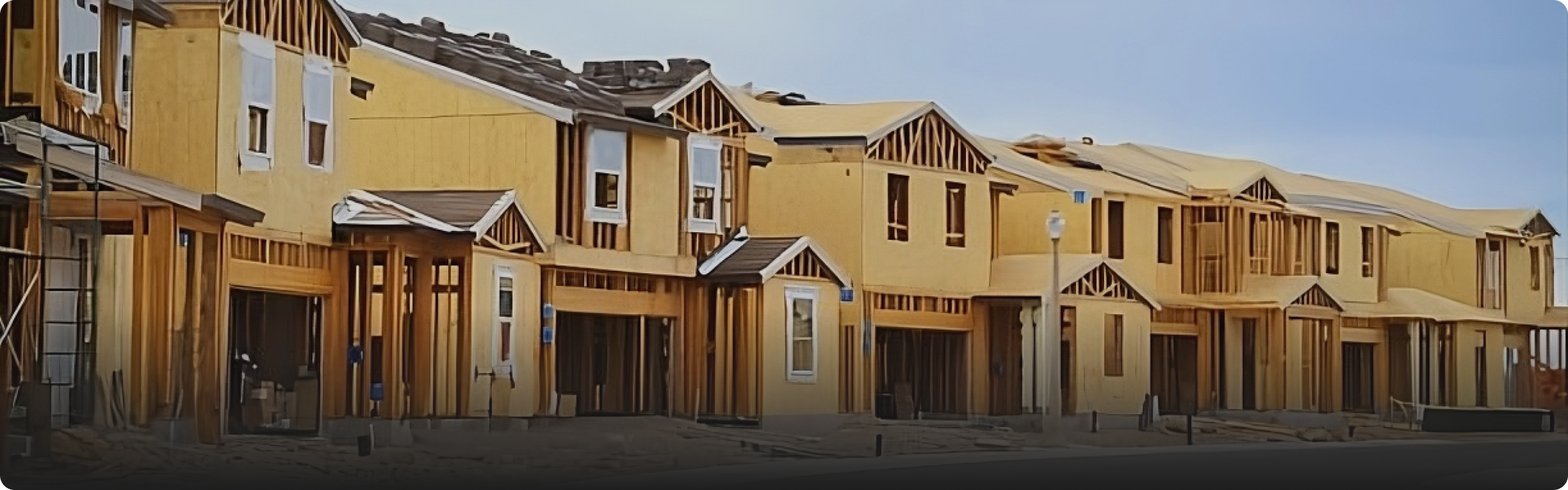 Construction site with yellow houses under development